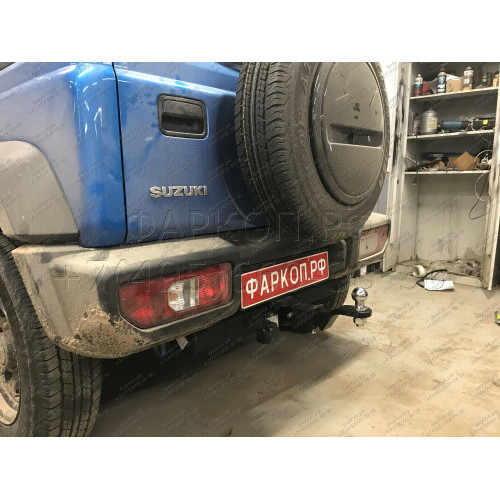 SZ 13 AVTOS Фаркоп на Suzuki Jimny 2018- без выреза в бампере. Тип шара: E. Нагрузки: 1200/75 кг, масса фаркопа 15 кг (без электрики в комплекте)