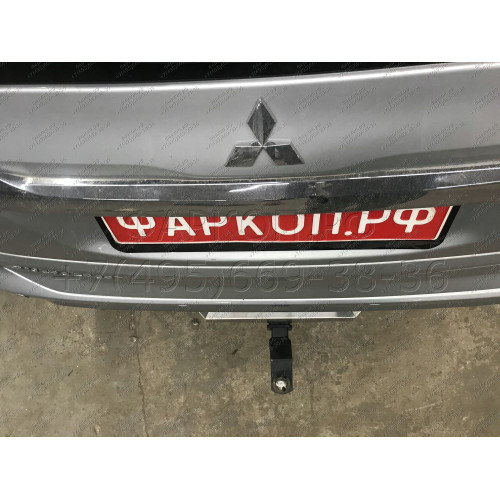 TCU00279 ТСС Фаркоп на Mitsubishi Pajero Sport 2021- с накладкой с надписью Pajero Sport без подрезки бампера. Тип шара: E (шаровый узел под американский квадрат). Нагрузки: 2500/120 кг