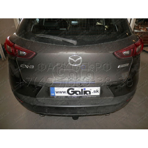 M137A GALIA Полностью оцинкованный фаркоп на Mazda CX-3 2015-. Подрозетник убирается за бампер. Тип шара: A. Невидимый вырез бампера. Нагрузки: 1800/80 кг, масса фаркопа 15,72 кг
