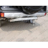 TCU00085 ТСС Фаркоп на Mitsubishi Pajero IV 2007-2020 с накладкой с надписью Pajero без подрезки бампера. Тип шара: E (шаровый узел под американский квадрат). Нагрузки: 1700/100 кг