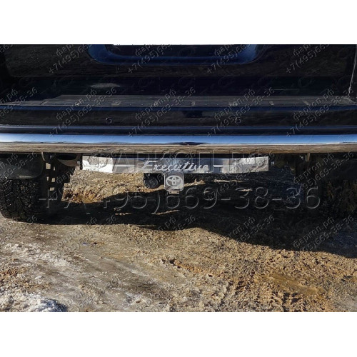 TCU00045 ТСС Фаркоп на Toyota Land Cruiser 200 Executive/Executive Lounge 2016-2021 с накладкой с надписью Executive без подрезки бампера. Тип шара: E (шаровый узел под американский квадрат). Нагрузки: 1500/100 кг